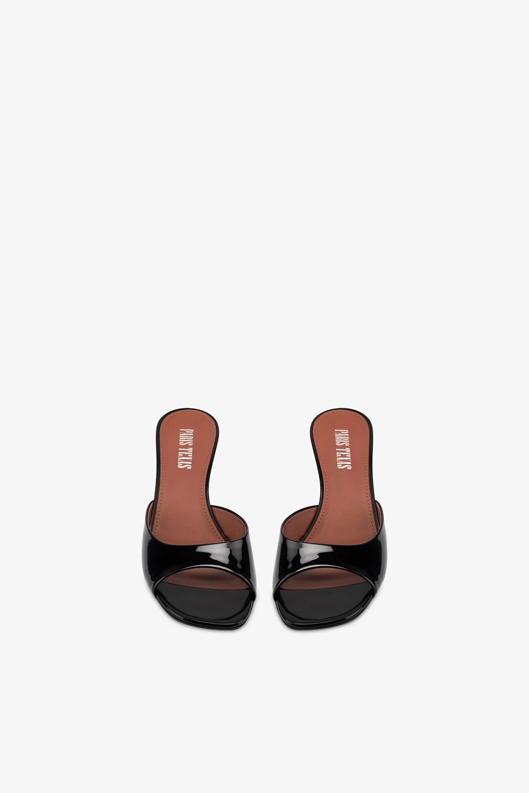 Mules in black patent leather